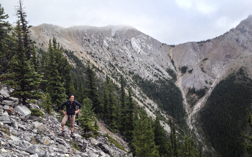 Dan poses with South Baldy hidden behind clouds and West Baldy to the right. The screen descent is visible in between.