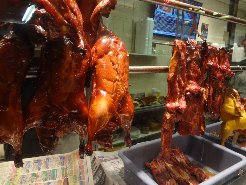 Some kind of BBQ meat in the window. Duck? Pork? Chicken?