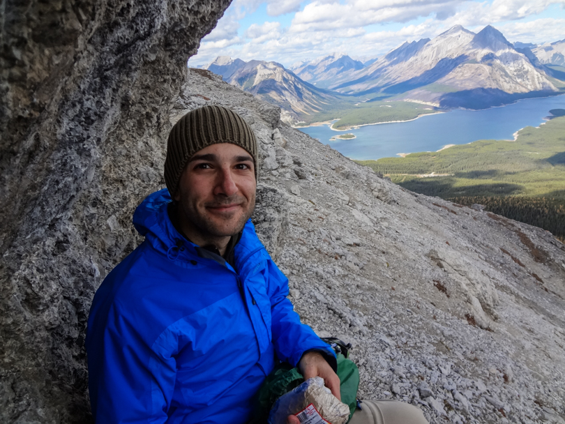 Taking refuge beside a cliff for a quick lunch stop