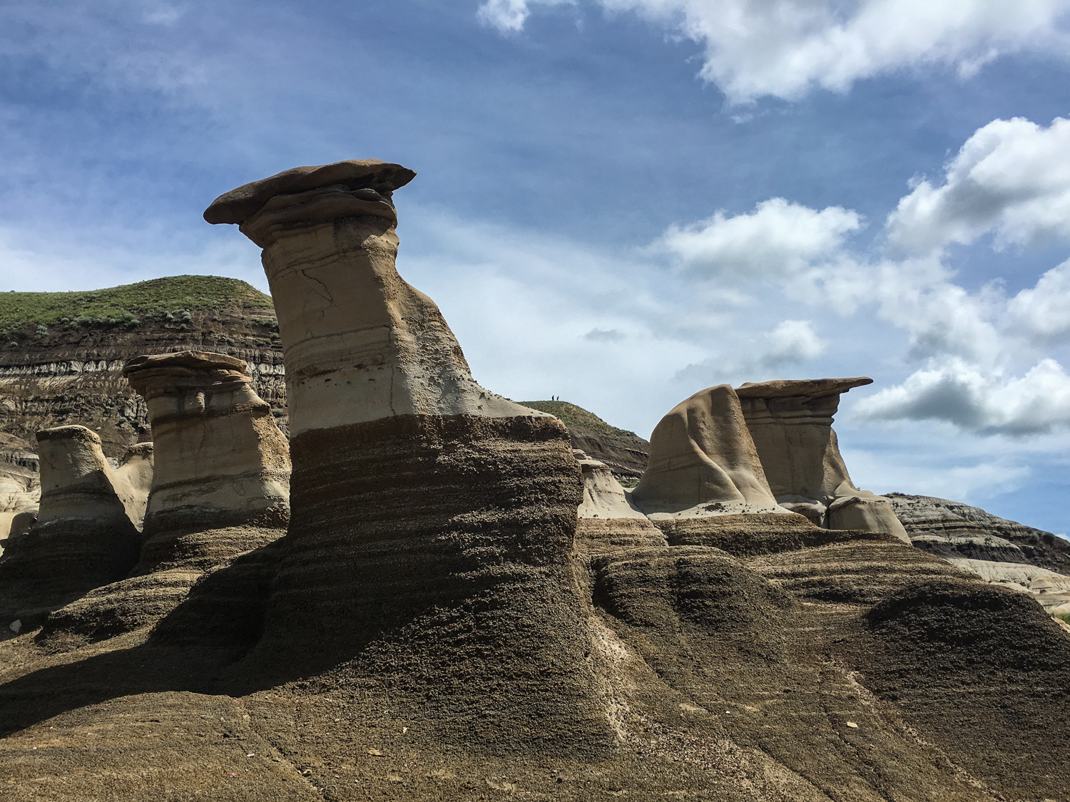 The hoodoos, made of sand and clay. The capstone protects the base, resulting in their awesome formation.