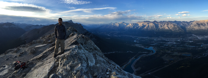 Ry at the summit with Canmore below