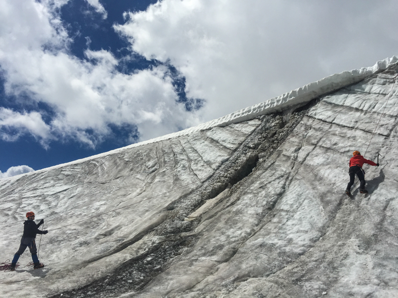 Climbing on the side of a glacier